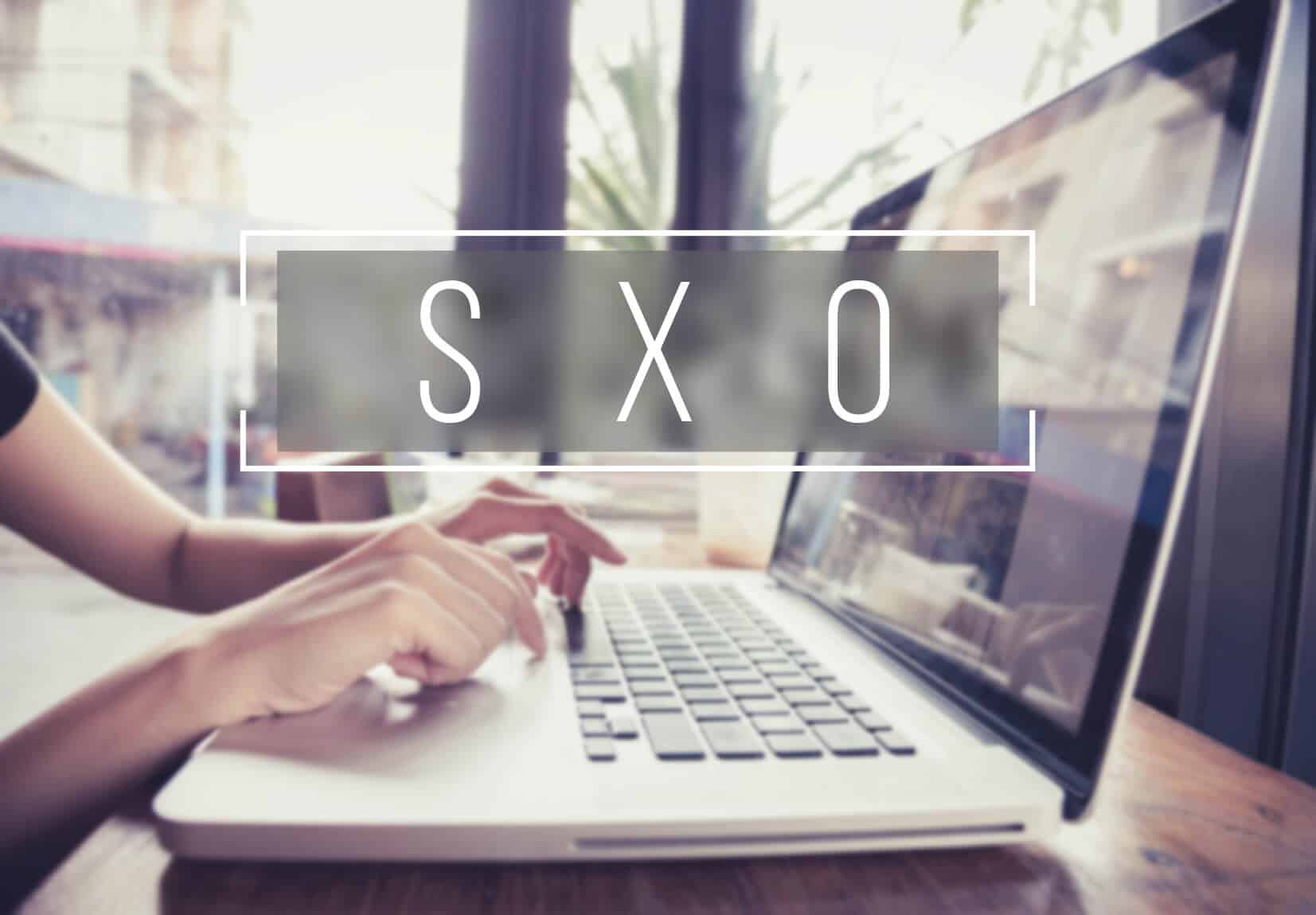 business hand typing on a laptop keyboard with Web Design homepa